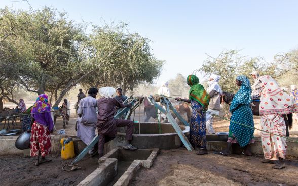 Herders gather in the morning around the watering hole in the pastoral zone.