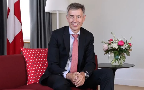 A man sitting on a sofa.