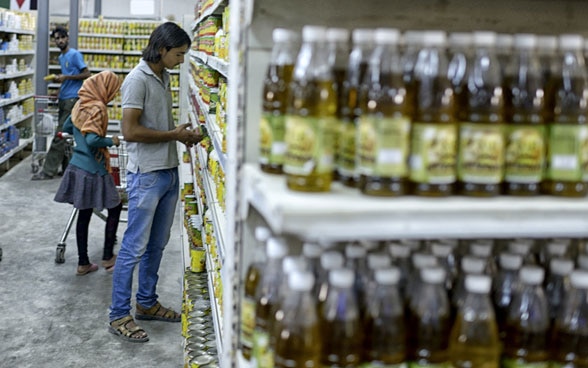 People buying goods at a supermarket.